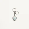 Coeur Hyperbole Taschenanhänger mit Schlüsselanhänger aus Metall, Kunststoff und Kristallen Coeur Hyperbole Taschenanhänger mit Schlüsselanhänger aus Metall, Kunststoff und Kristallen