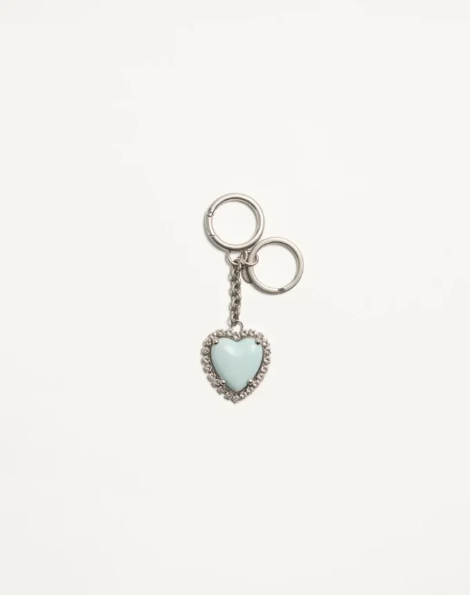 Coeur Hyperbole Taschenanhänger mit Schlüsselanhänger aus Metall, Kunststoff und Kristallen Coeur Hyperbole Taschenanhänger mit Schlüsselanhänger aus Metall, Kunststoff und Kristallen