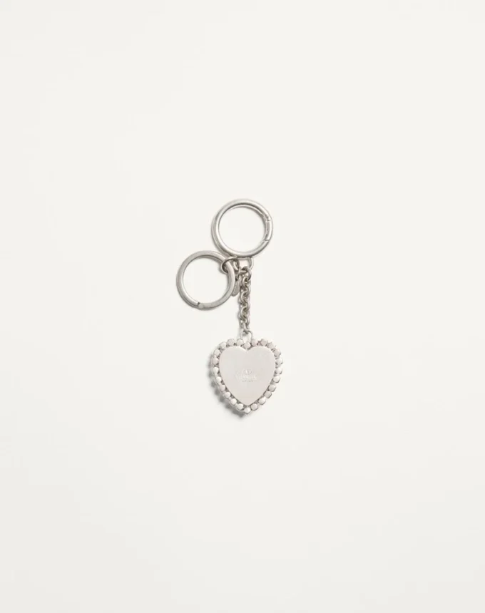 Coeur Hyperbole Taschenanhänger mit Schlüsselanhänger aus Metall, Kunststoff und Kristallen Coeur Hyperbole Taschenanhänger mit Schlüsselanhänger aus Metall, Kunststoff und Kristallen