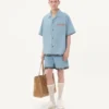 Denim-Bermudashorts mit Blumenprint am Saum Denim-Bermudashorts mit Blumenprint am Saum