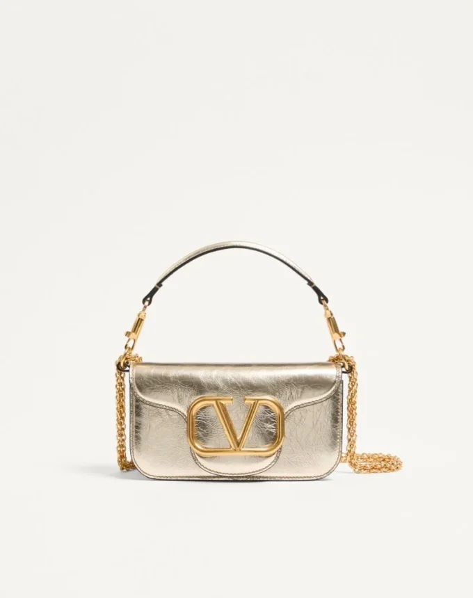 Kleine Valentino Garavani Locò Schultertasche aus metallischem Kalbsleder Kleine Valentino Garavani Locò Schultertasche aus metallischem Kalbsleder