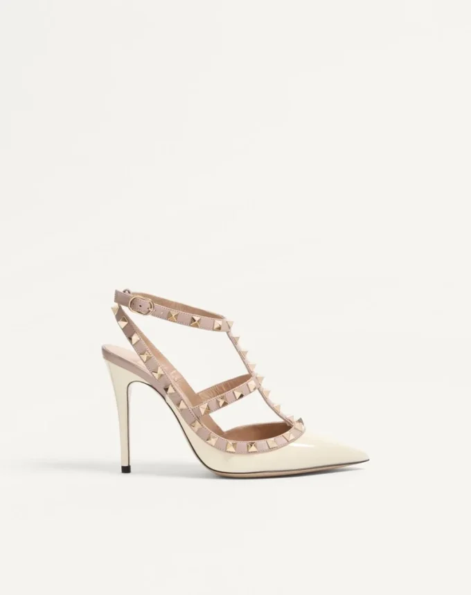 Lackleder-Pumps mit Rockstud-Käfig 100 mm Lackleder-Pumps mit Rockstud-Käfig 100 mm