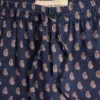 Leichte Leinenhose mit Umschlag und Voyage Imaginaire-Print Leichte Leinenhose mit Umschlag und Voyage Imaginaire-Print