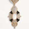 Pas Plus Ohrringe aus Metall, Harz, Emaille und Swarovski®-Kristallen Pas Plus Ohrringe aus Metall, Harz, Emaille und Swarovski®-Kristallen