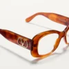 Rechteckige Acetatbrille im Stil der 70er Jahre Rechteckige Acetatbrille im Stil der 70er Jahre