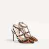Rockstud Pumps mit Riemchen aus Kalbsleder in Pony-Optik 100 mm Rockstud Pumps mit Riemchen aus Kalbsleder in Pony-Optik 100 mm
