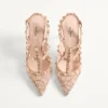 Rockstud-Pumps mit Riemchen und 100-mm-Absatz