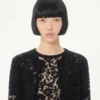Strickjacke aus Spitze und Baumwolle Strickjacke aus Spitze und Baumwolle