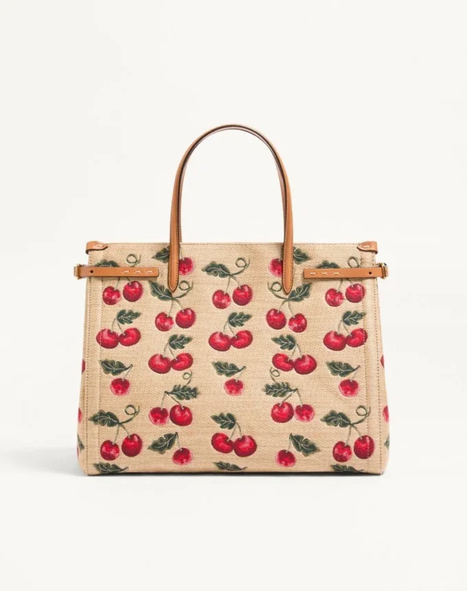Valentino Garavani Antibes Medium Shopping Bag aus Jacquard-Raffia mit Cherryfic-Motiv Valentino Garavani Antibes Medium Shopping Bag aus Jacquard-Raffia mit Cherryfic-Motiv