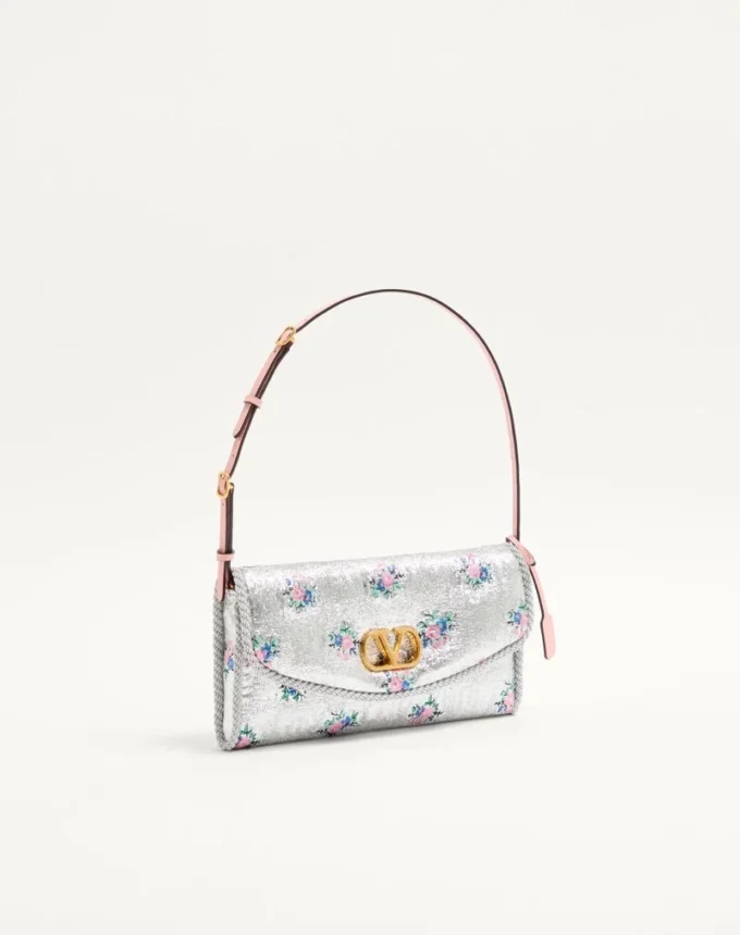 Valentino Garavani DeVain Kleine Umhängetasche aus floralem Lurex-Jacquard-Stoff Valentino Garavani DeVain Kleine Umhängetasche aus floralem Lurex-Jacquard-Stoff