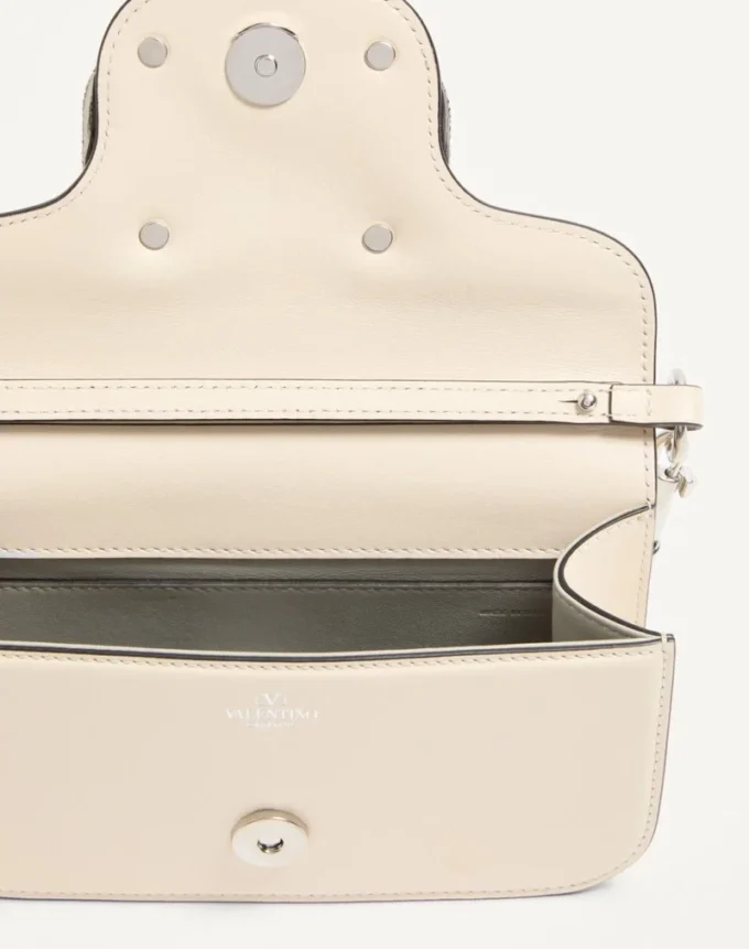 Valentino Garavani Locò Kleine Umhängetasche mit Juwelenlogo Valentino Garavani Locò Kleine Umhängetasche mit Juwelenlogo