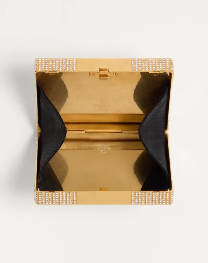 Valentino Garavani Minaumorphe Minaudière aus Metall mit Swarovski®-Kristallen und Satinbeutel Valentino Garavani Minaumorphe Minaudière aus Metall mit Swarovski®-Kristallen und Satinbeutel