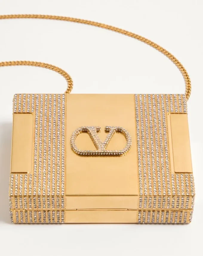 Valentino Garavani Minaumorphe Minaudière aus Metall mit Swarovski®-Kristallen und Satinbeutel Valentino Garavani Minaumorphe Minaudière aus Metall mit Swarovski®-Kristallen und Satinbeutel