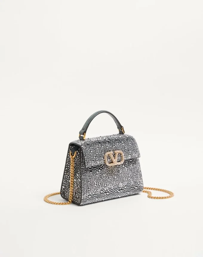 Valentino Garavani Mini-Umhängetasche mit Strasssteinen und Juwelenlogo Valentino Garavani Mini-Umhängetasche mit Strasssteinen und Juwelenlogo