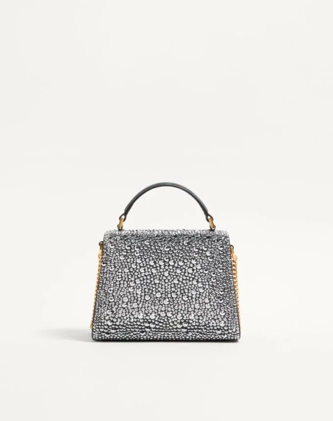 Valentino Garavani Mini-Umhängetasche mit Strasssteinen und Juwelenlogo Valentino Garavani Mini-Umhängetasche mit Strasssteinen und Juwelenlogo