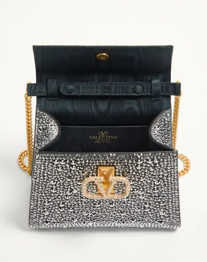 Valentino Garavani Mini-Umhängetasche mit Strasssteinen und Juwelenlogo Valentino Garavani Mini-Umhängetasche mit Strasssteinen und Juwelenlogo