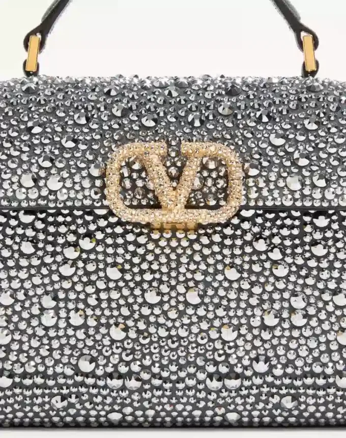 Valentino Garavani Mini-Umhängetasche mit Strasssteinen und Juwelenlogo Valentino Garavani Mini-Umhängetasche mit Strasssteinen und Juwelenlogo