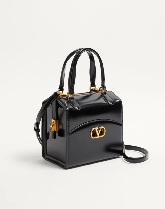 Valentino Garavani Vain-Case Bowlingtasche aus glänzendem Kalbsleder Valentino Garavani Vain-Case Bowlingtasche aus glänzendem Kalbsleder