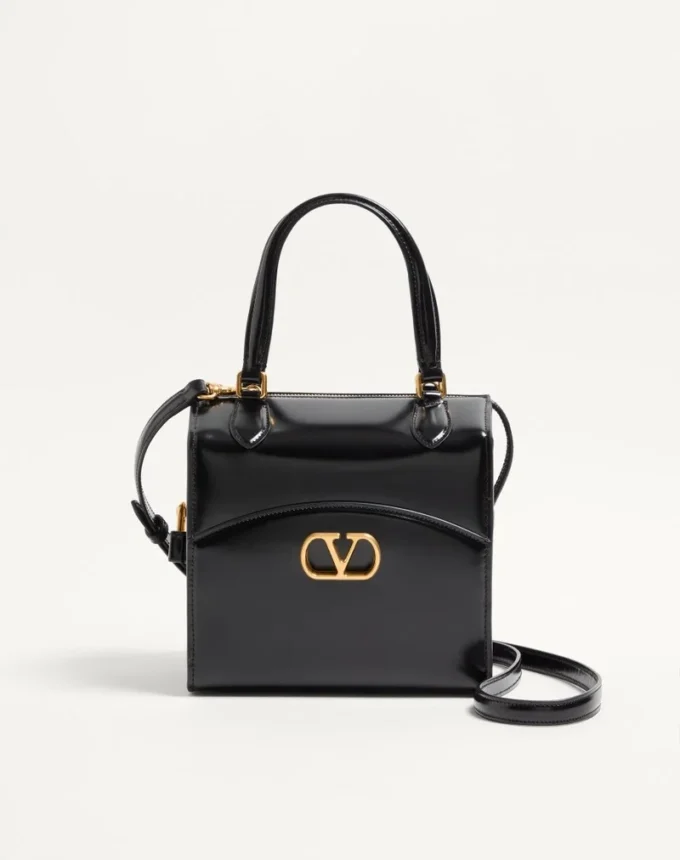 Valentino Garavani Vain-Case Bowlingtasche aus glänzendem Kalbsleder Valentino Garavani Vain-Case Bowlingtasche aus glänzendem Kalbsleder