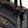 Valentino Garavani Vain-Case Bowlingtasche aus glänzendem Kalbsleder Valentino Garavani Vain-Case Bowlingtasche aus glänzendem Kalbsleder