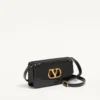 Valentino Garavani Vain Clutch aus glänzendem Kalbsleder Valentino Garavani Vain Clutch aus glänzendem Kalbsleder