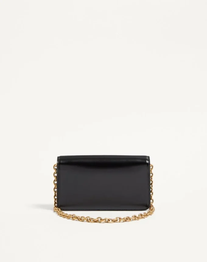 Valentino Garavani Vain Clutch aus glänzendem Kalbsleder Valentino Garavani Vain Clutch aus glänzendem Kalbsleder