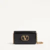Valentino Garavani Vain Clutch aus glänzendem Kalbsleder Valentino Garavani Vain Clutch aus glänzendem Kalbsleder