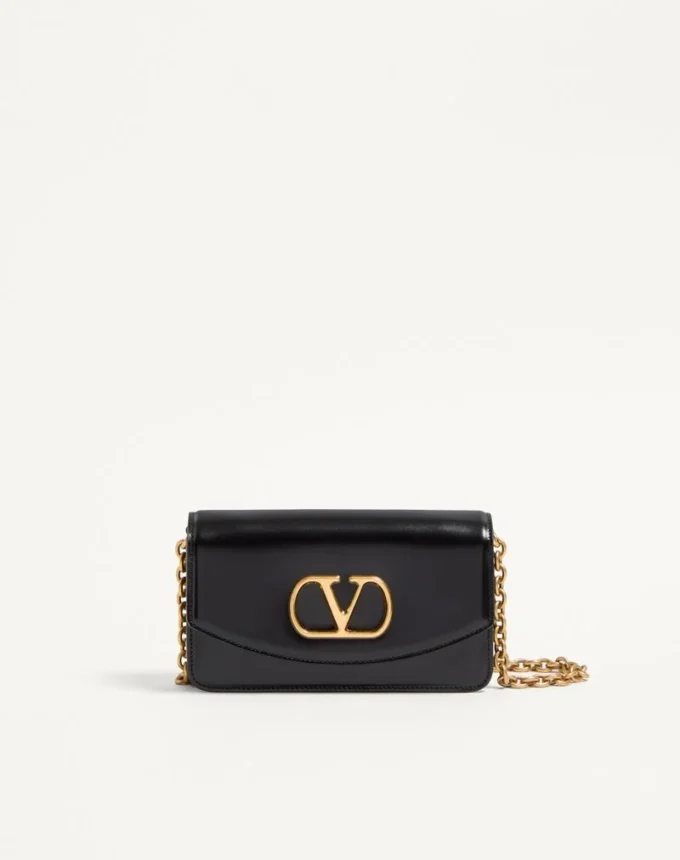 Valentino Garavani Vain Clutch aus glänzendem Kalbsleder Valentino Garavani Vain Clutch aus glänzendem Kalbsleder