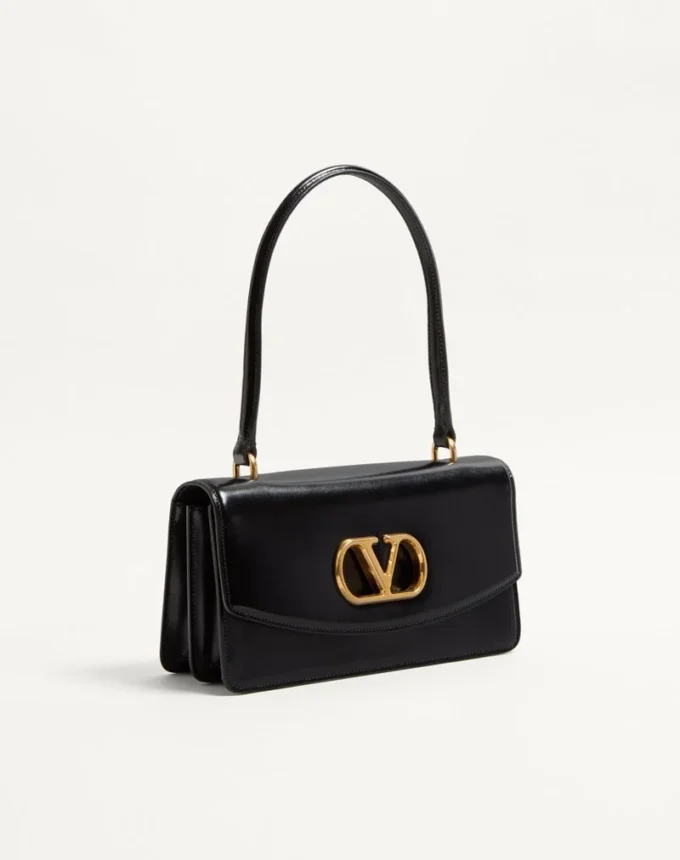 Valentino Garavani Vain Tasche mit Griff aus glänzendem Kalbsleder Valentino Garavani Vain Tasche mit Griff aus glänzendem Kalbsleder