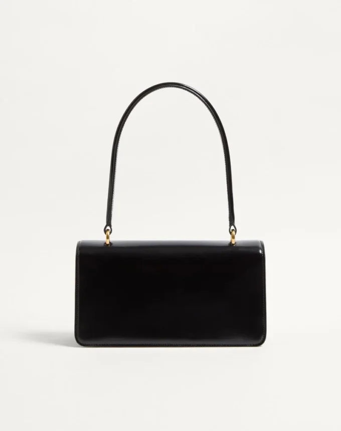 Valentino Garavani Vain Tasche mit Griff aus glänzendem Kalbsleder Valentino Garavani Vain Tasche mit Griff aus glänzendem Kalbsleder