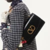 Valentino Garavani Vain Tasche mit Griff aus glänzendem Kalbsleder Valentino Garavani Vain Tasche mit Griff aus glänzendem Kalbsleder