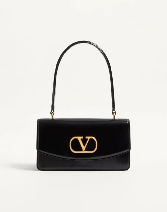 Valentino Garavani Vain Tasche mit Griff aus glänzendem Kalbsleder Valentino Garavani Vain Tasche mit Griff aus glänzendem Kalbsleder