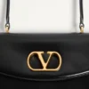 Valentino Garavani Vain Tasche mit Griff aus glänzendem Kalbsleder Valentino Garavani Vain Tasche mit Griff aus glänzendem Kalbsleder