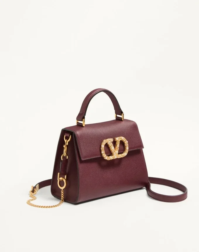 Valentino Garavani Vsling Kleine Handtasche aus genarbtem Kalbsleder mit Juwelenlogo Valentino Garavani Vsling Kleine Handtasche aus genarbtem Kalbsleder mit Juwelenlogo