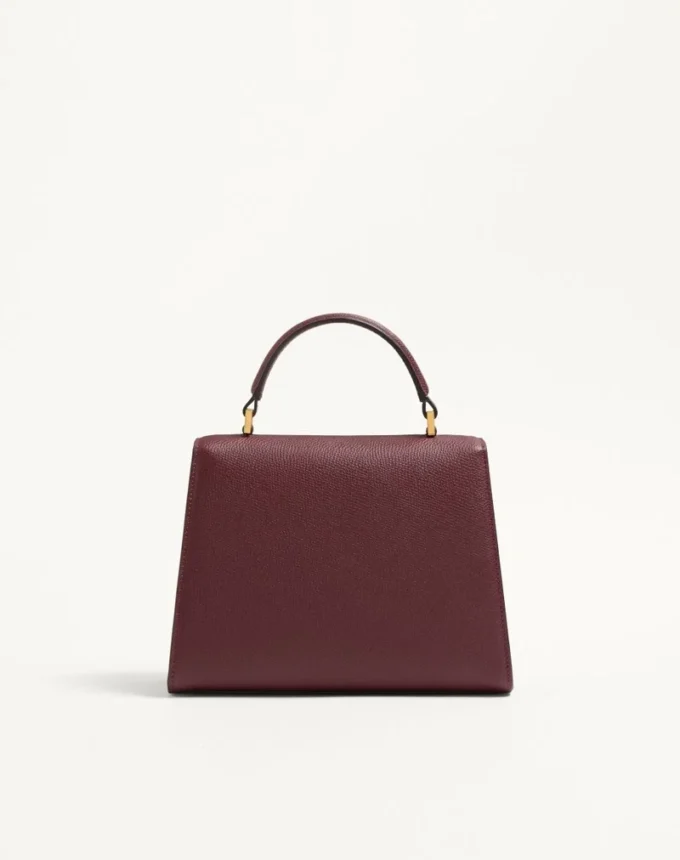 Valentino Garavani Vsling Kleine Handtasche aus genarbtem Kalbsleder mit Juwelenlogo Valentino Garavani Vsling Kleine Handtasche aus genarbtem Kalbsleder mit Juwelenlogo