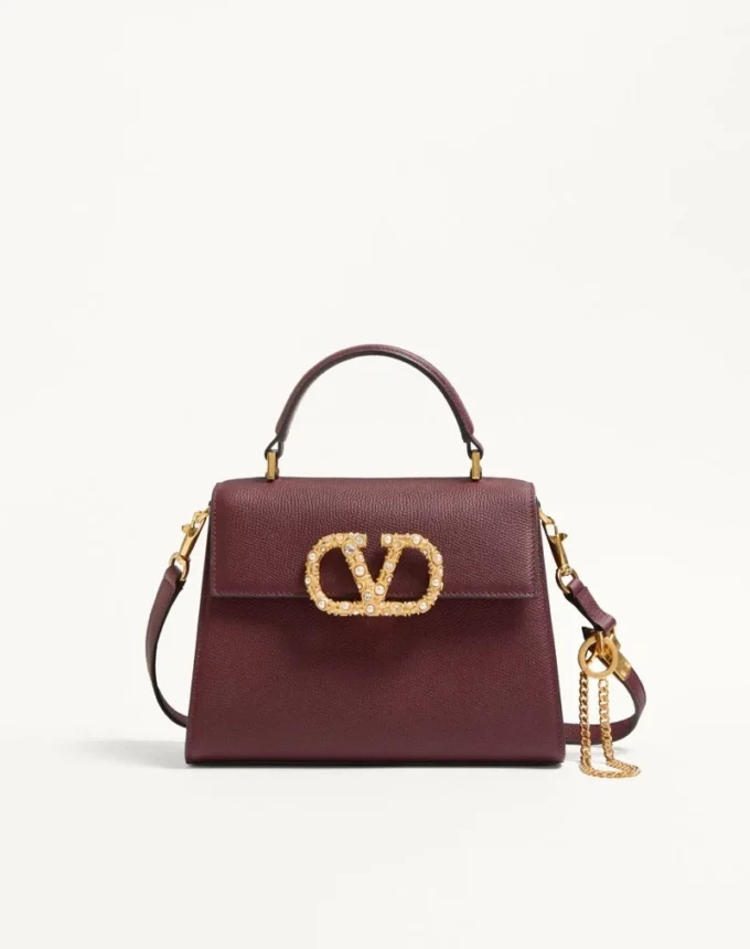 Valentino Garavani Vsling Kleine Handtasche aus genarbtem Kalbsleder mit Juwelenlogo Valentino Garavani Vsling Kleine Handtasche aus genarbtem Kalbsleder mit Juwelenlogo