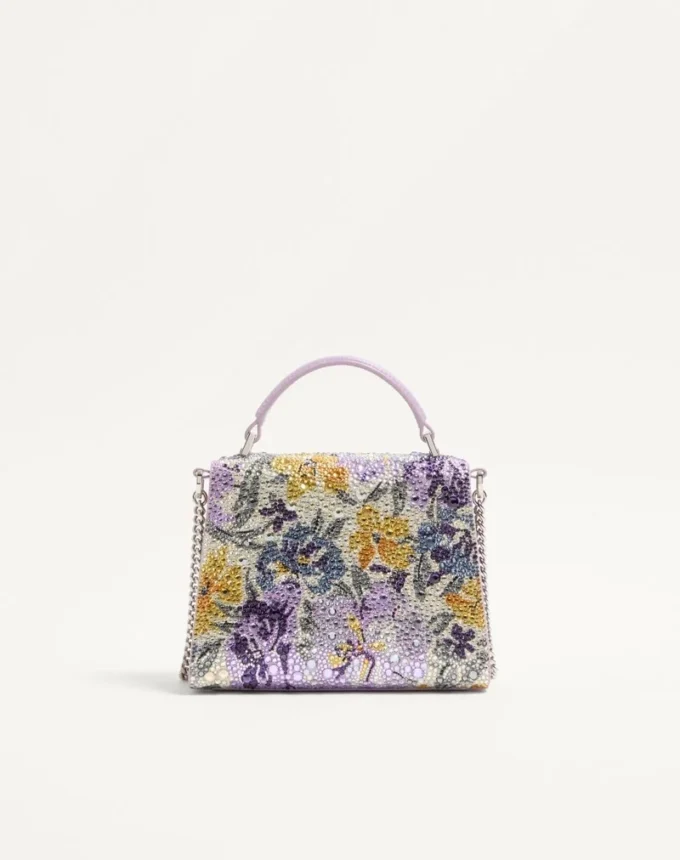 Valentino Garavani Vsling Mini-Handtasche mit Flowerism-Strassmotiv und Juwelenlogo Valentino Garavani Vsling Mini-Handtasche mit Flowerism-Strassmotiv und Juwelenlogo