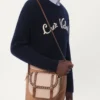 Wollpullover mit Rundhalsausschnitt und Chez Valentino-Stickerei Wollpullover mit Rundhalsausschnitt und Chez Valentino-Stickerei